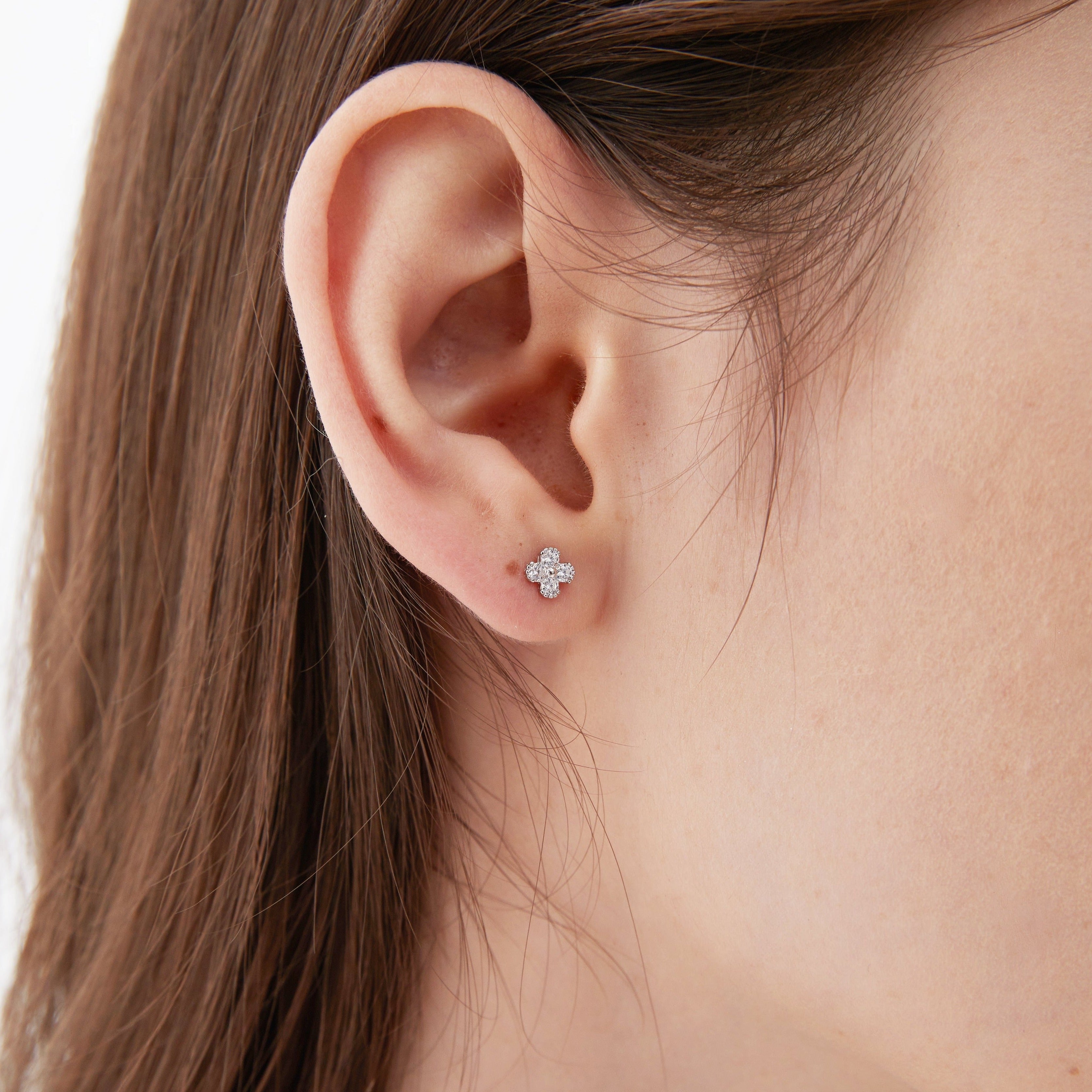 4-Leaf Clover Stud Earrings  in silver on ear