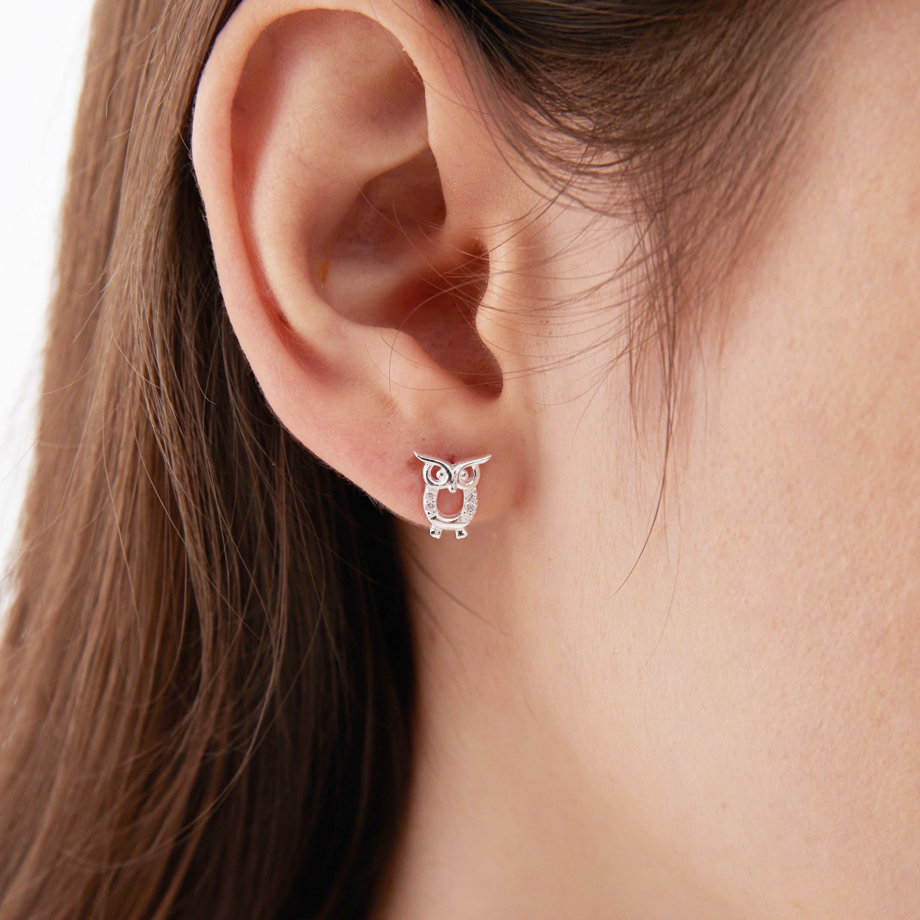 STMG Owl Stud Earrings on ear