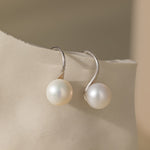 STMG Freshwater Pearl Hook Earrings in silver on ear