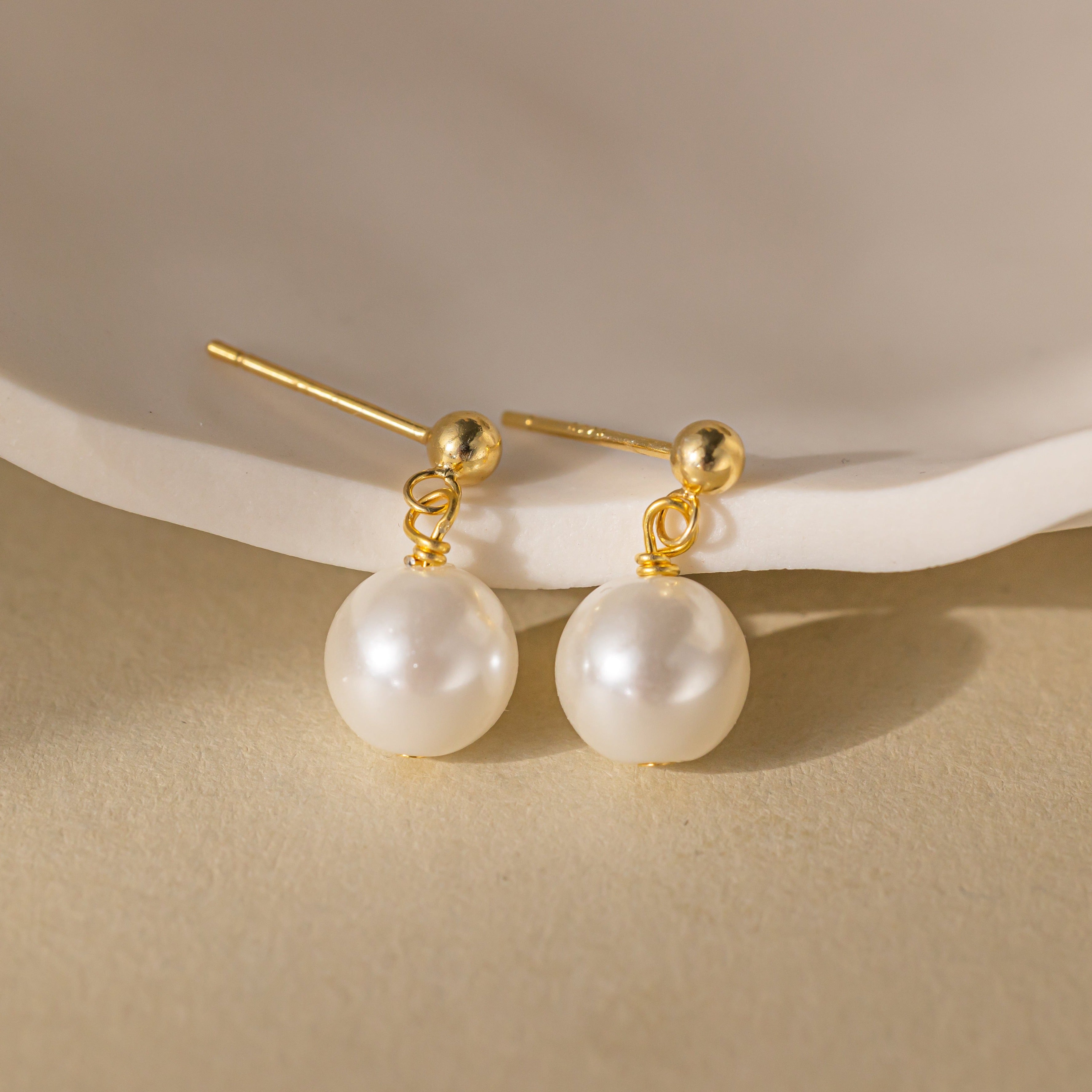 STMG Pearl Dangle Earrings in gold