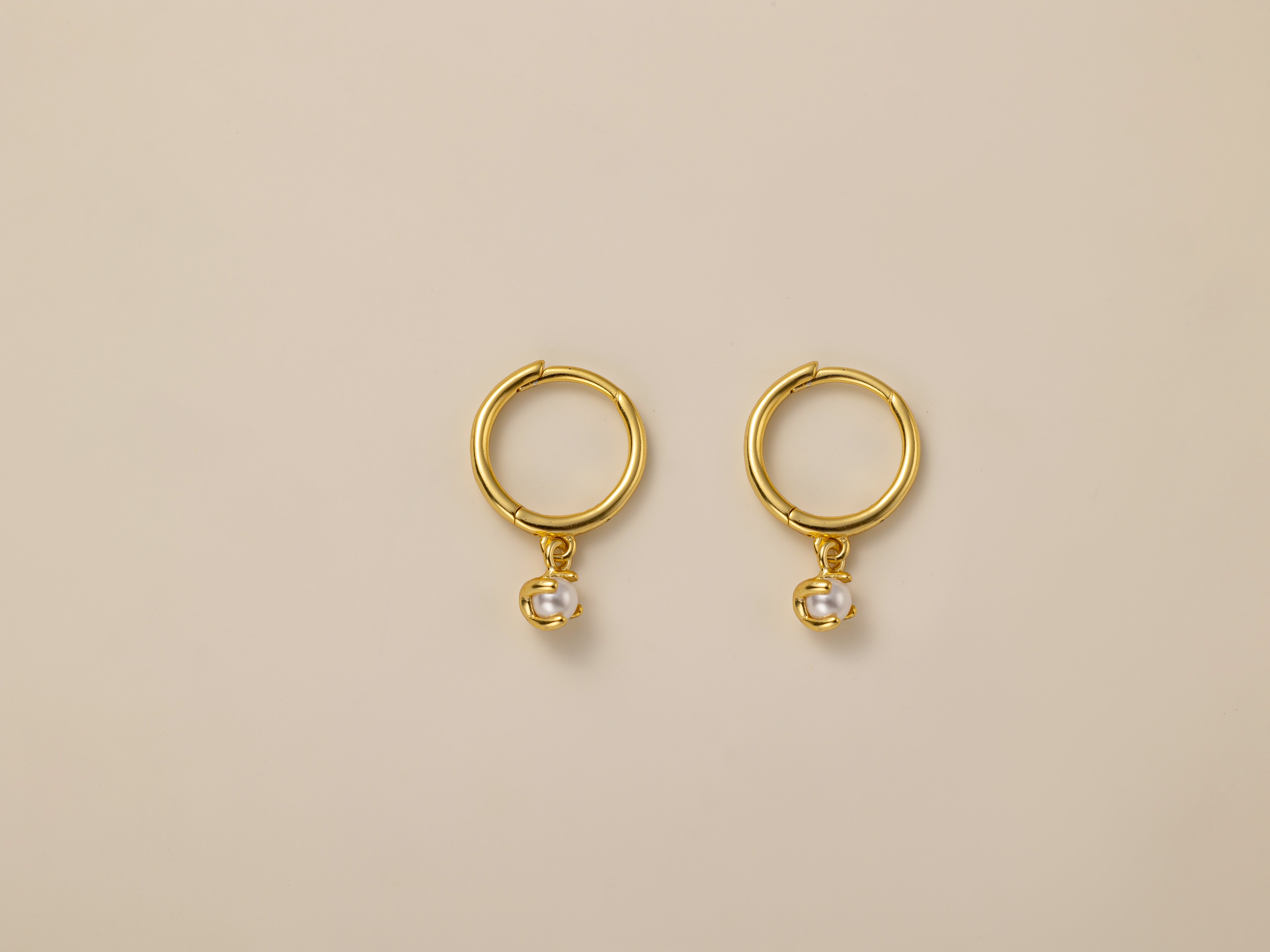 STMG Pearl Dangle Hoops in gold