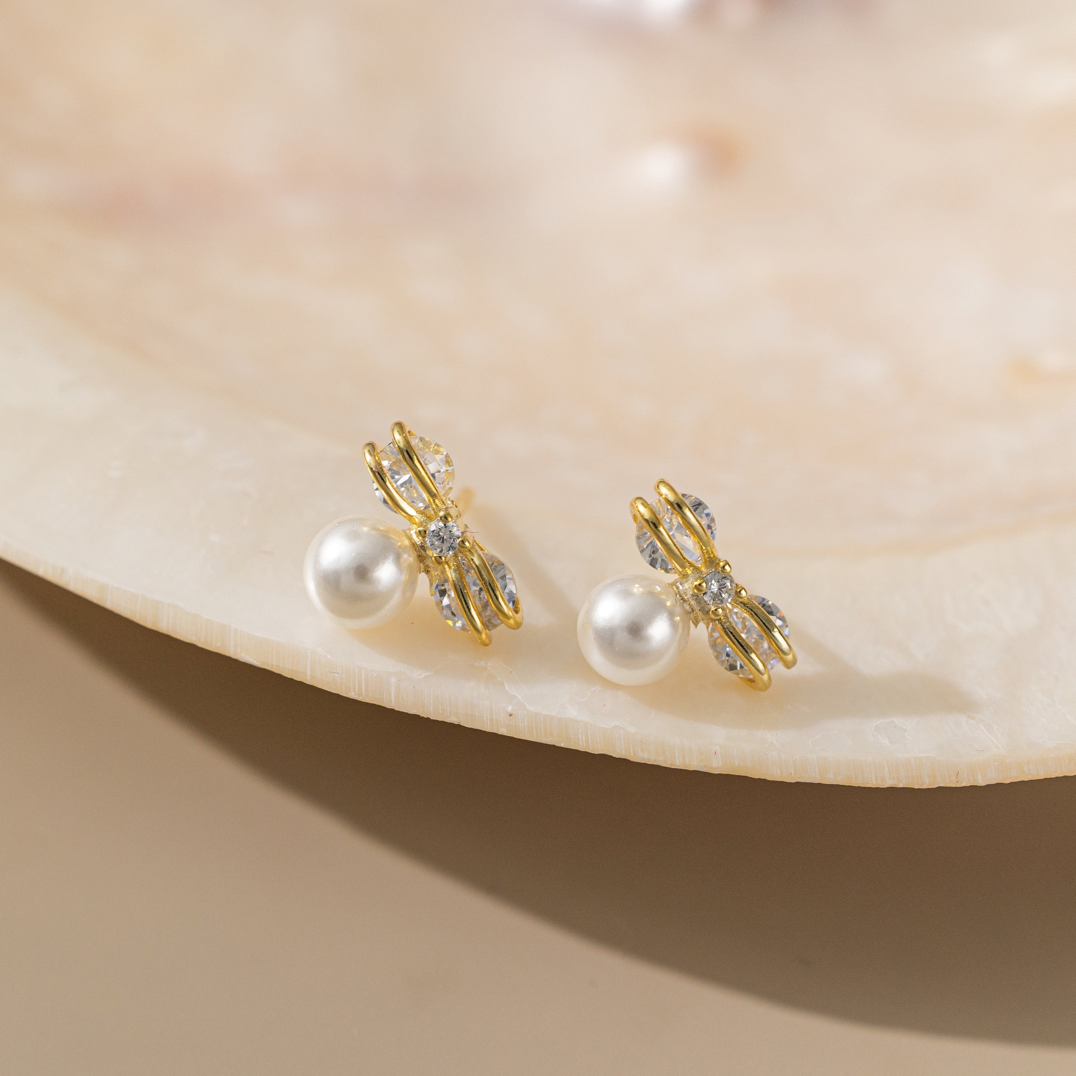 STMG Pearl on Bowknot Stud Earrings in gold