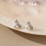 STMG Pearl on Bowknot Stud Earrings in silver