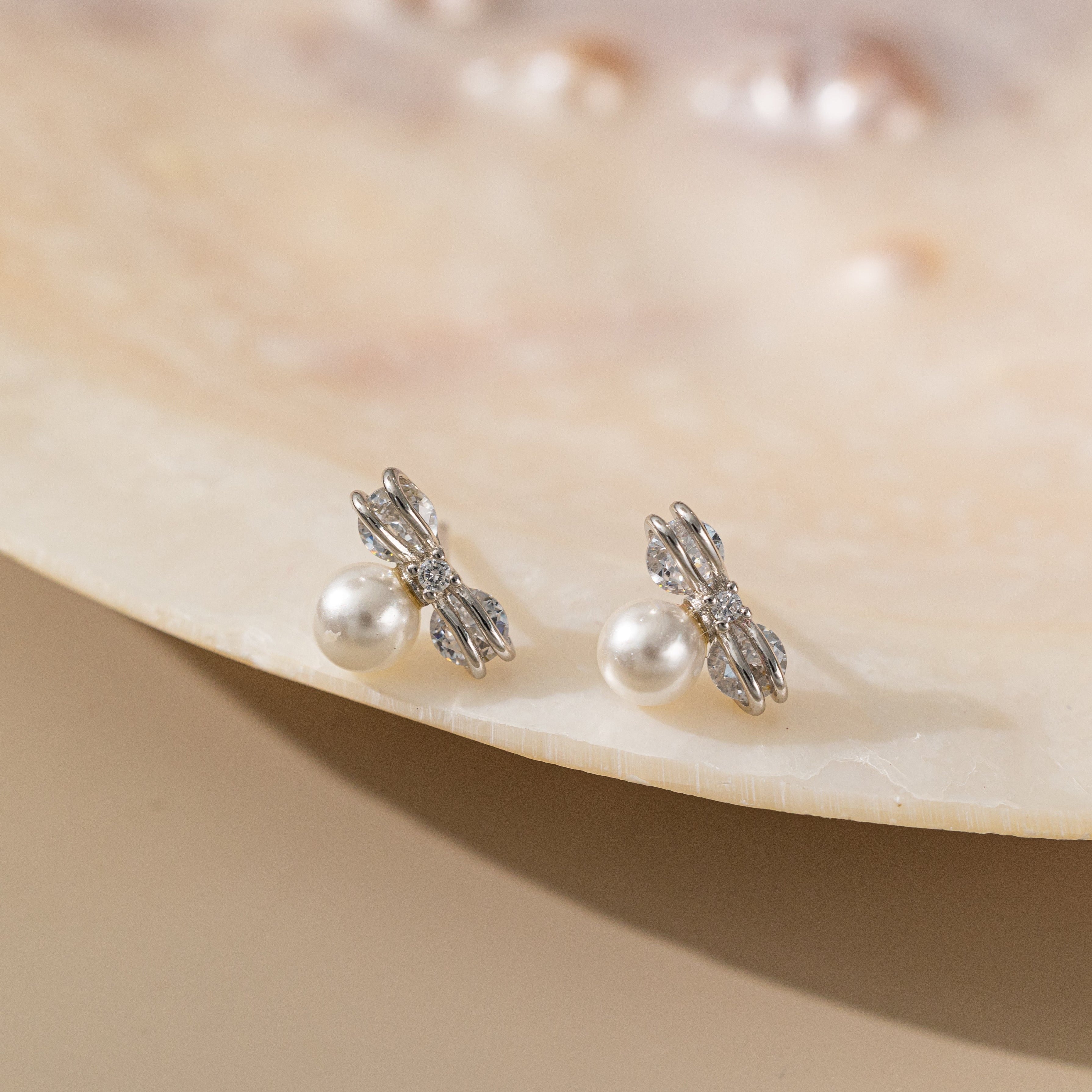 STMG Pearl on Bowknot Stud Earrings in silver