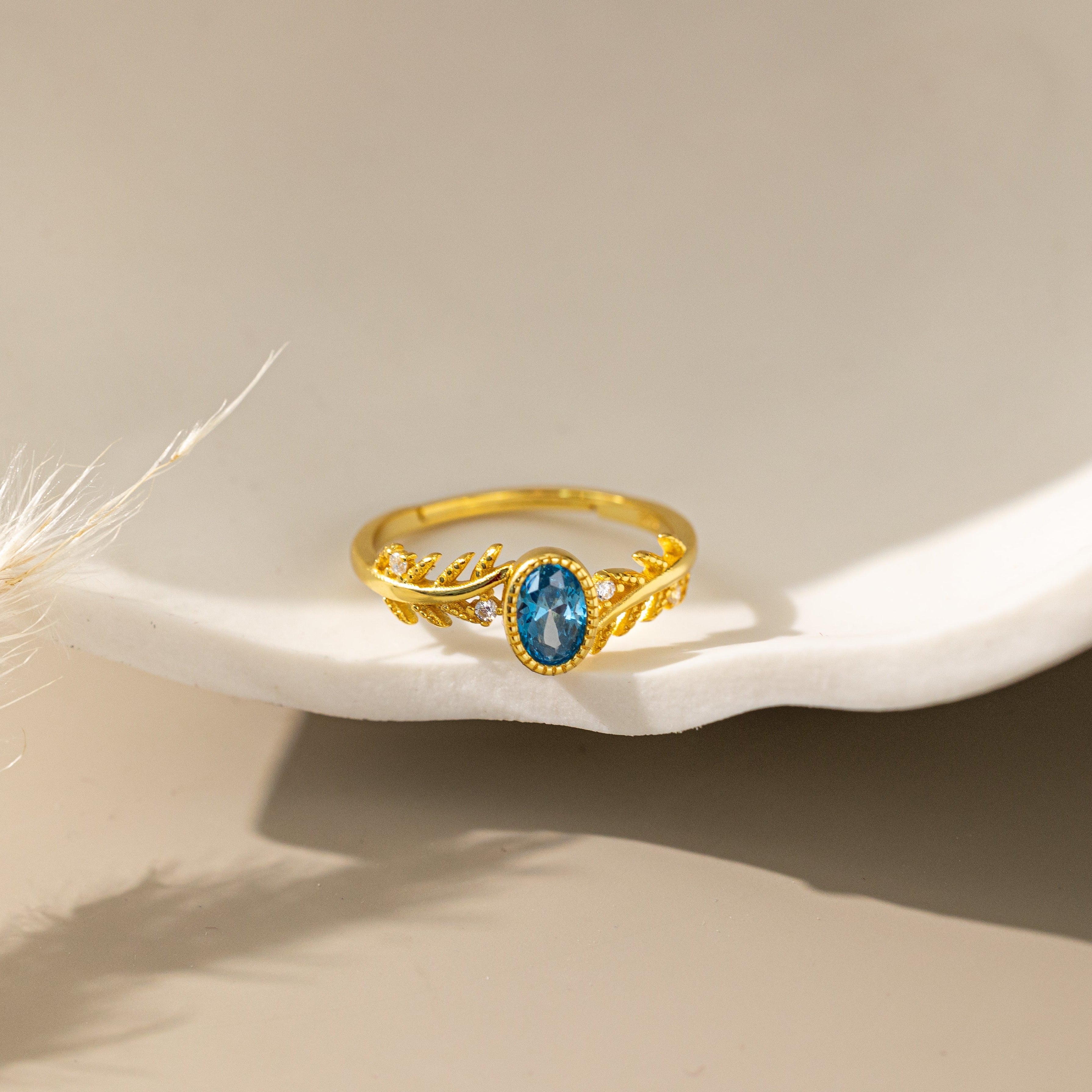 Blue Topaz on Olive Leaf Ring in gold