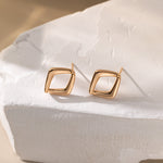 STMG Minimalist Rhombus Stud Earrings in champagne gold