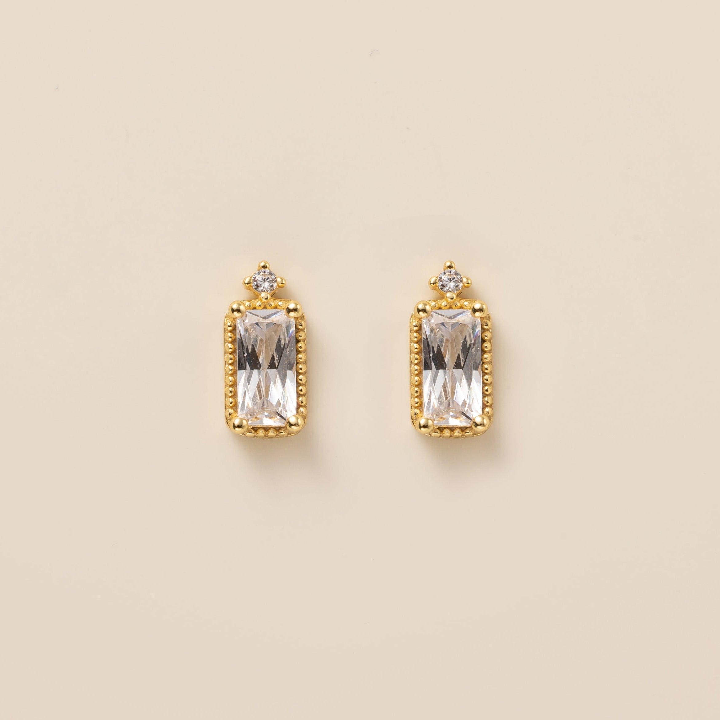 Emerald Cut Diamond Stud Earrings in gold