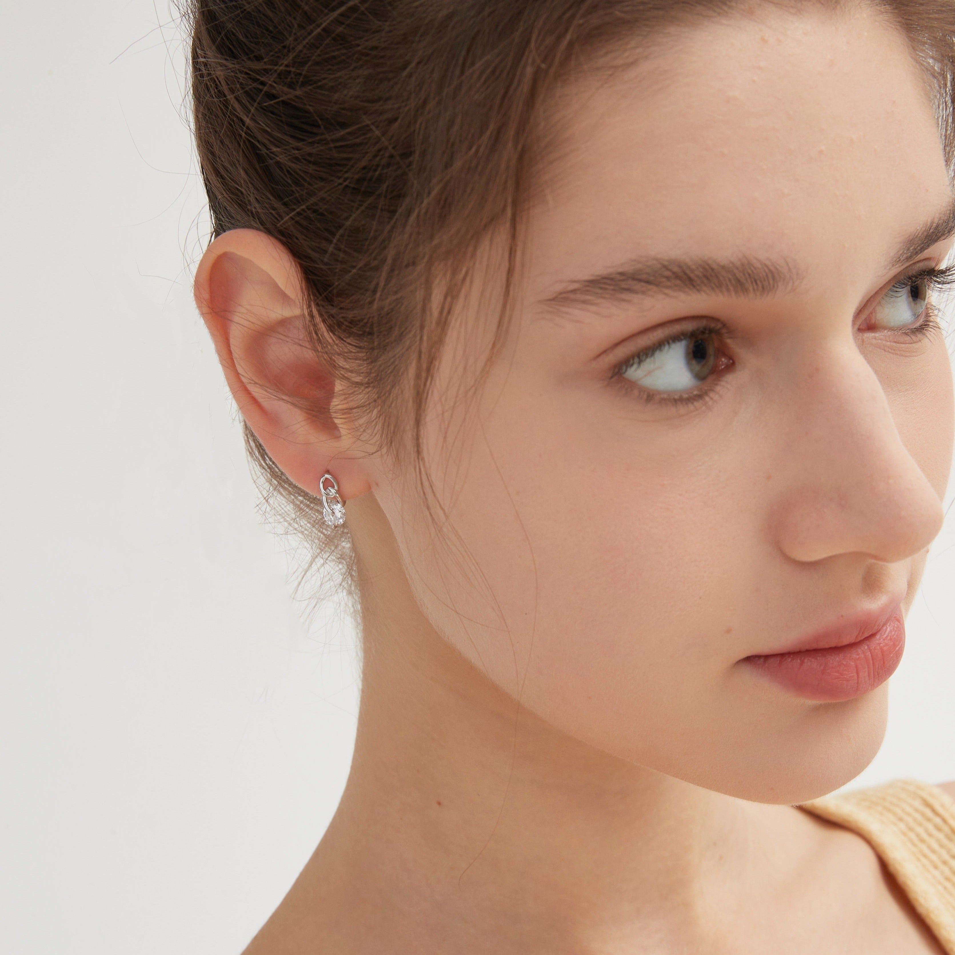 Diamond on Chain Hoops in silver on ear