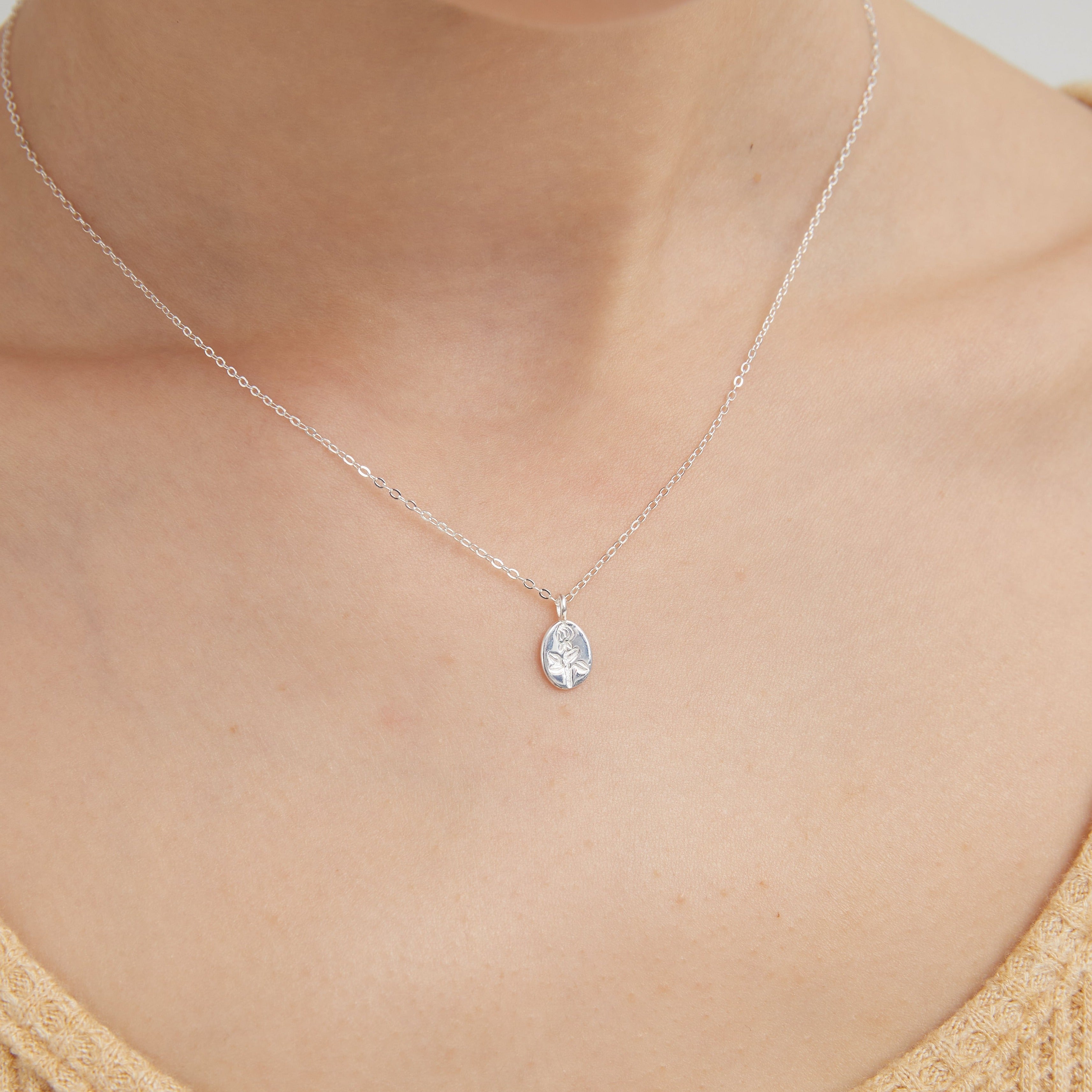 STMG Oval Plate Rose Necklace in silver on neck