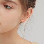 Geometric Droplet Hoops in gold on ear