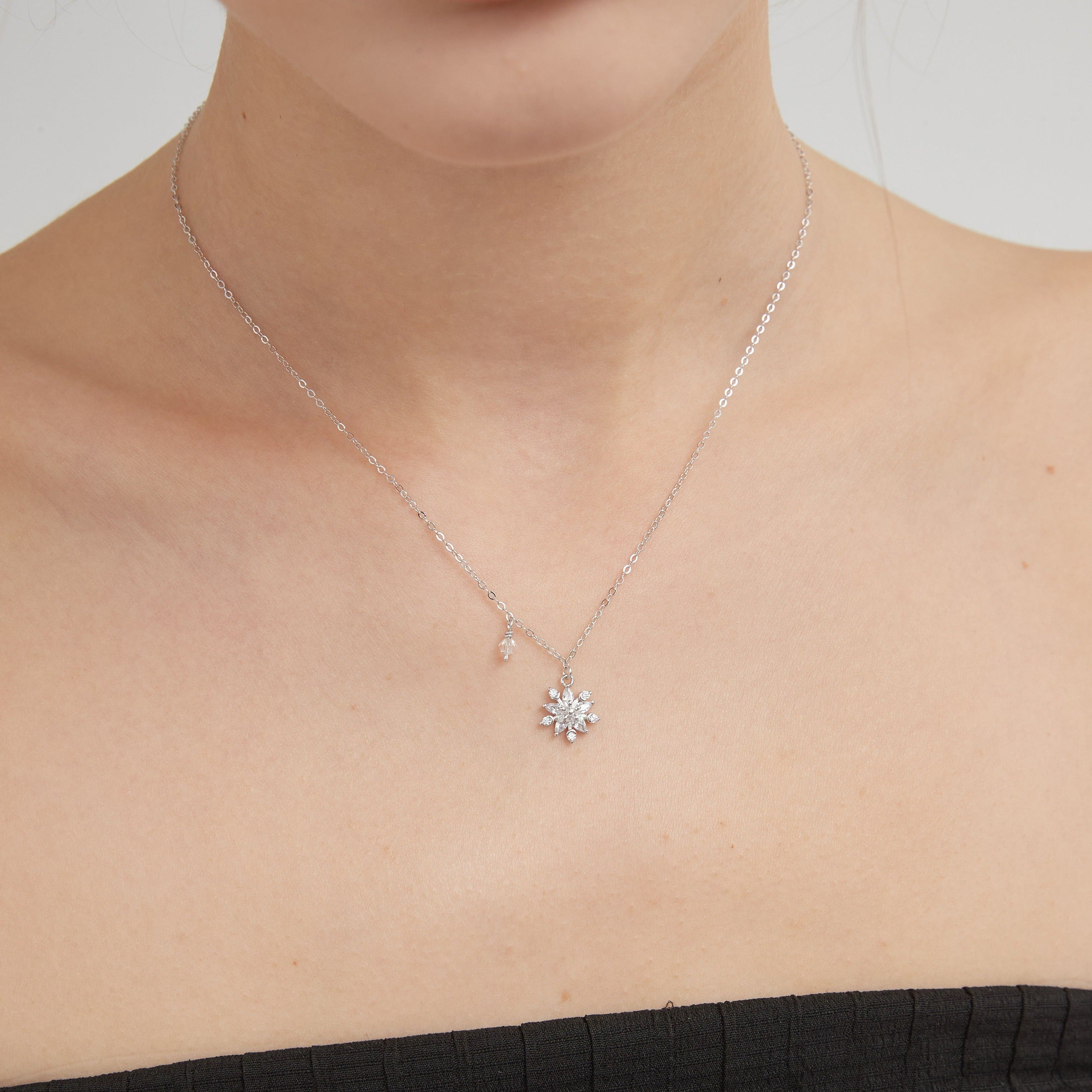 STMG Snowflake Necklace in silver on neck