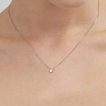 STMG Minimalist Star Necklace on neck