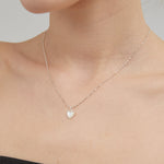 STMG Natural Mother of Pearl Heart Necklace on neck