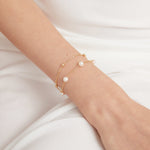 Duo Layer Natural Pearl Bracelet in gold on hand