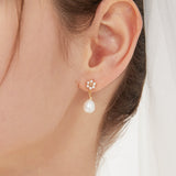 STMG Natural Pearl Flower Dangle Earrings on ear