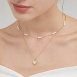 STMG Natural Mother of Pearl Heart Necklace on neck