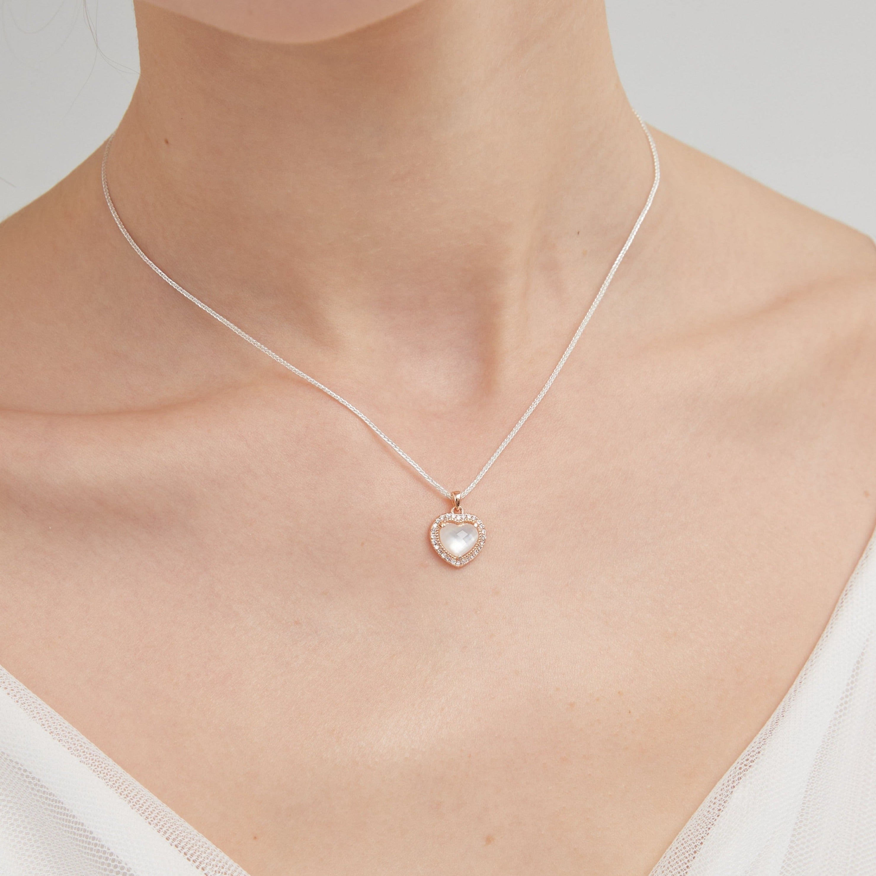 STMG Natural Mother of Pearl Heart Necklace on neck