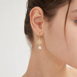 STMG Pearl Snowflake Dangle Earrings on ear