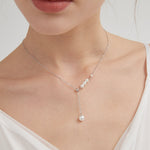 STMG Pearl Necklace in silver on neck