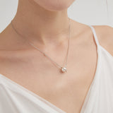 STMG Pearl Planet with CZ Stars Necklace in silver on neck