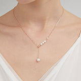 STMG Pearl Necklace in champagne gold on neck