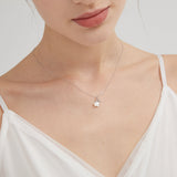 STMG Skinny Star Necklace in silver on neck