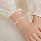 STMG Natural Pearl Adjustable Bracelet on hand