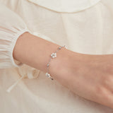 STMG Pearl Daisy Bracelet in silver on hand