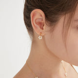 STMG Pearl Daisy Dangle Earrings on ear