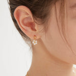 STMG Pearl Daisy Dangle Earrings on ear