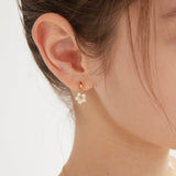 STMG Pearl Daisy Dangle Earrings on ear