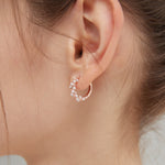 STMG Pearl Wreath Hoops in rose gold on ear