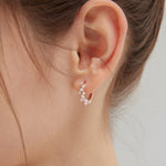 STMG Pearl Wreath Hoops in rose gold on ear