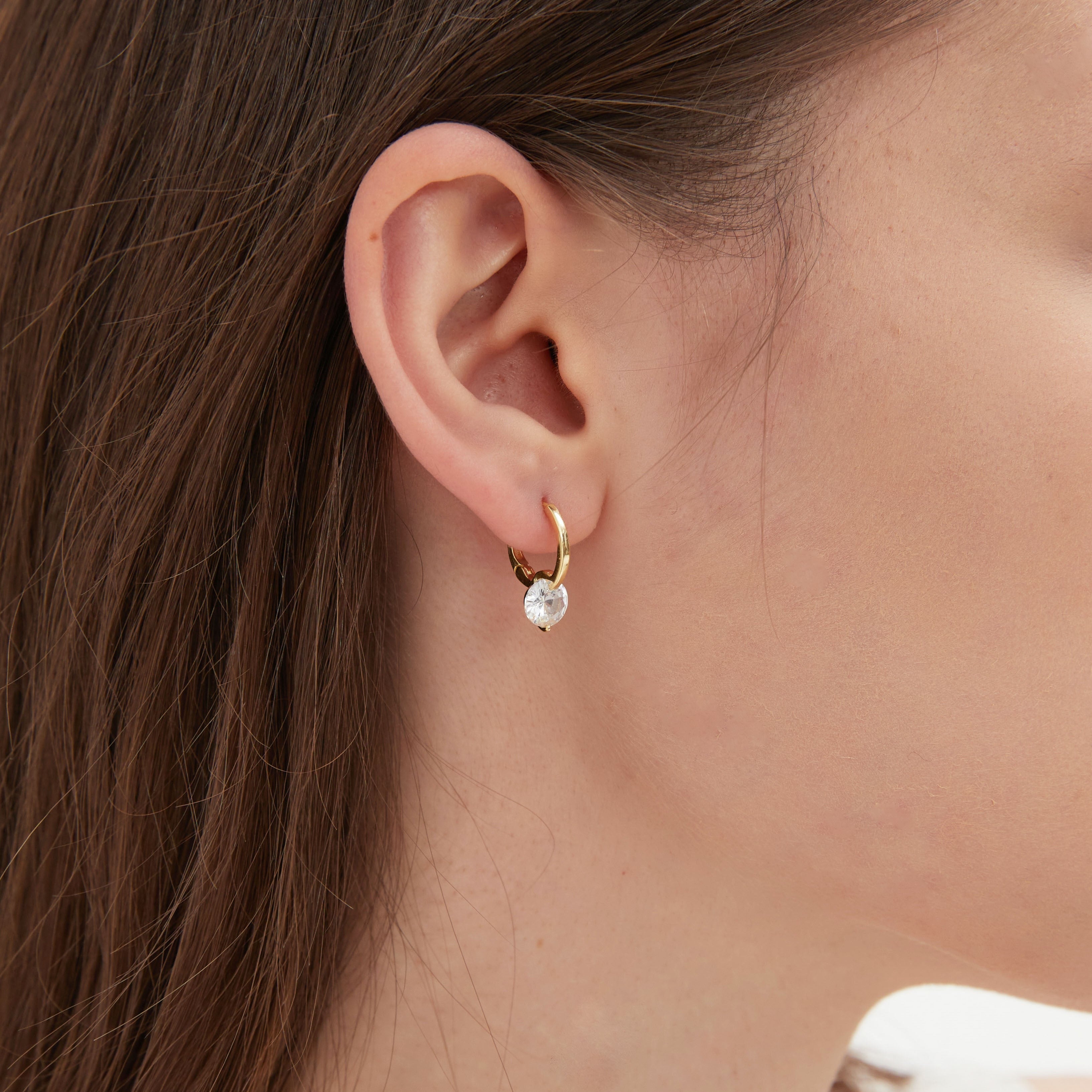 STMG Sparkly Crystal Hoops in gold on ear