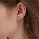 Emerald Green Hoops in silver on ear