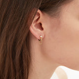 Chain Dangle Hoops in gold on ear