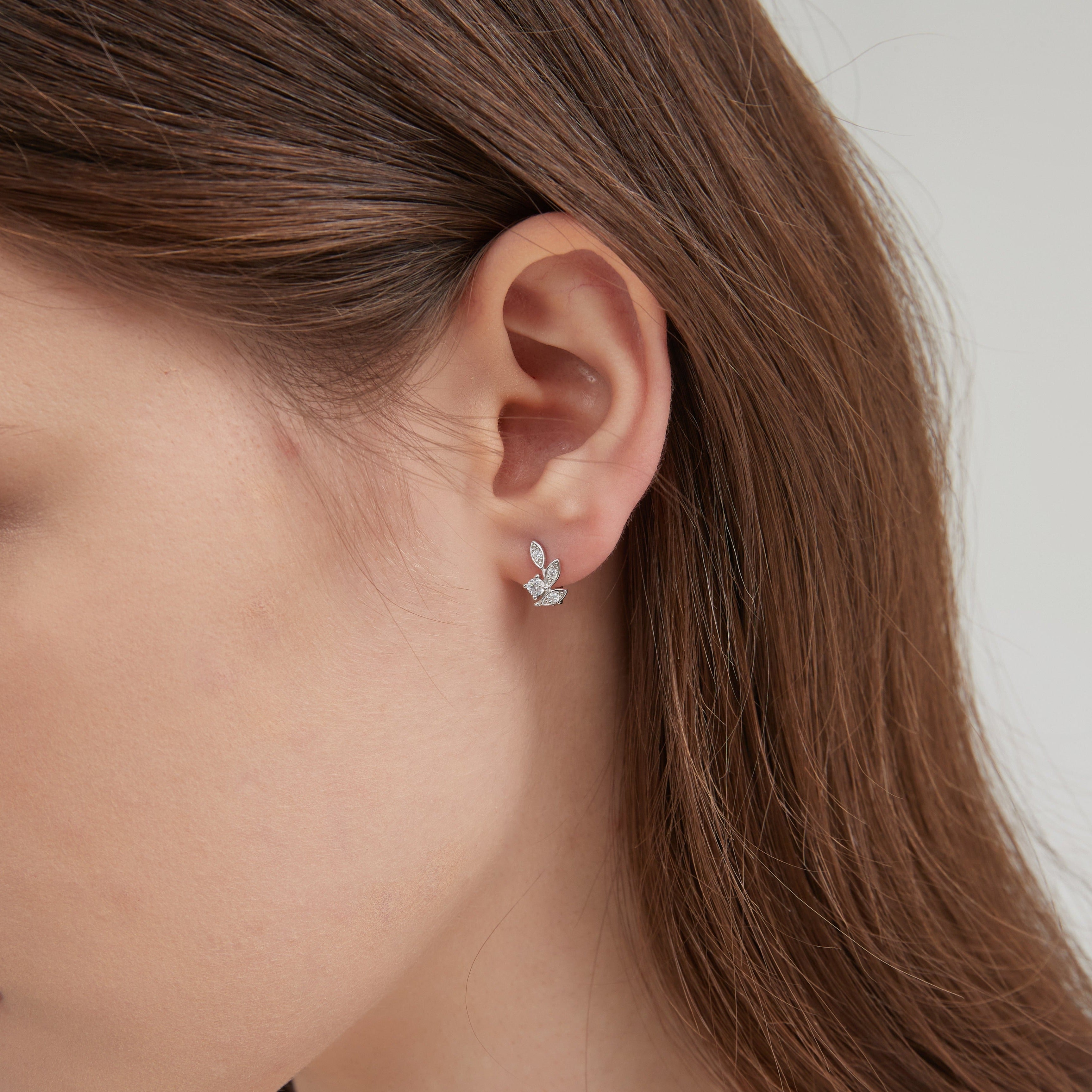 STMG Tiny Olive Leaf Hoops in silver on ear