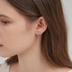 STMG Snake Hoops in silver on ear