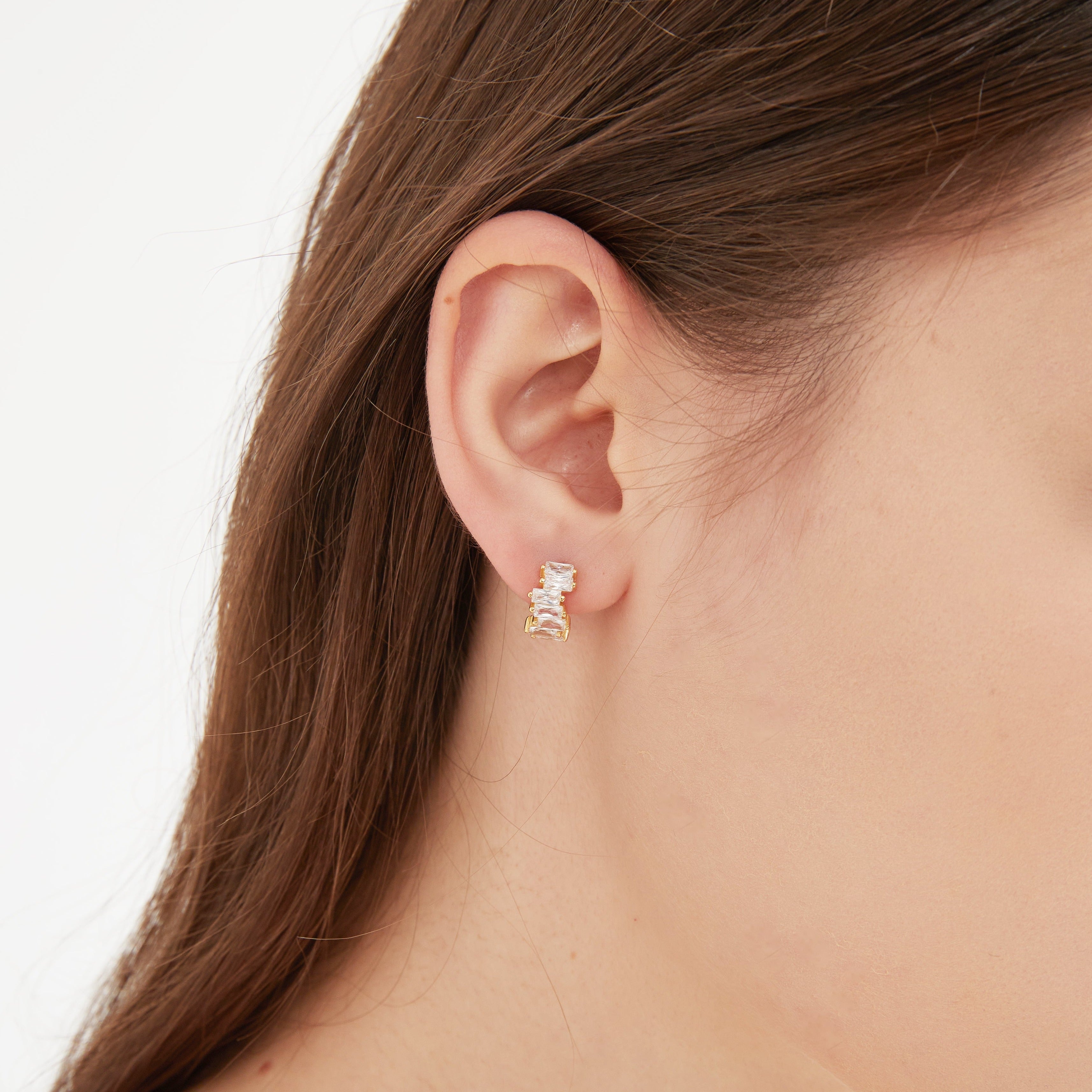 CZ Baguette Hoops in gold on ear