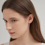 STMG Moonstone Stud Earrings in champagne gold on ear