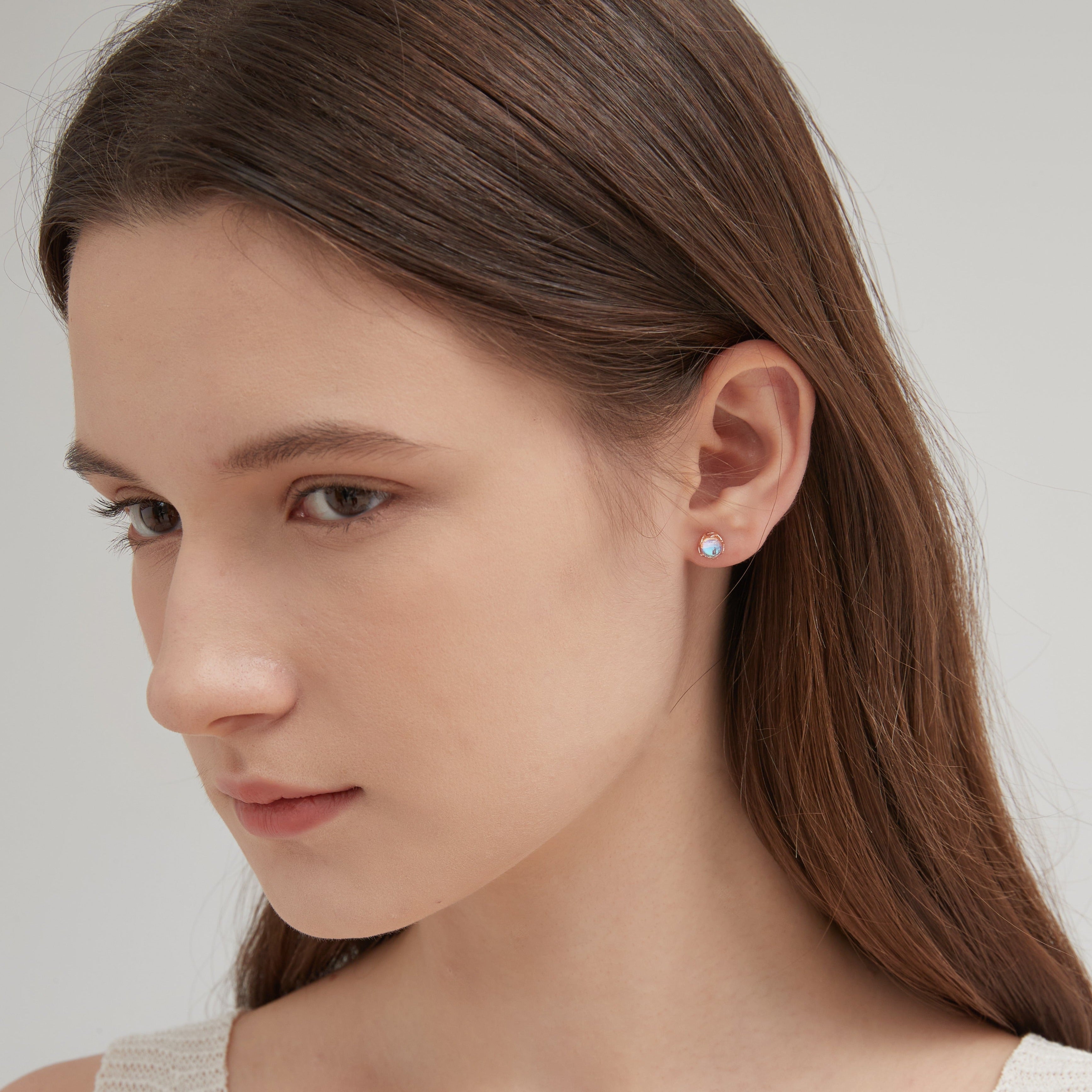 STMG Moonstone Stud Earrings in champagne gold on ear