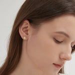 STMG Natural Pearl on Wreath Stud Earrings on ear