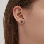 STMG Minimalist Emerald Earrings in silver on ear