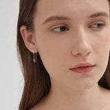 Bauhinia Dangle Earrings on ear