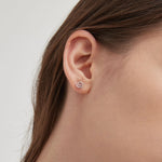 STMG Spiral Circular Stud Earrings in silver on ear