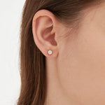 STMG Tiny Crown Stud Earrings in gold on ear