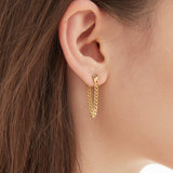 Chain Tassel Dangle Earrings in gold on ear