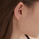 Cable Chain Dangle Earrings in gold on ear