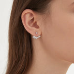 Angel Wing Stud Earrings in silver on ear