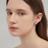 Angel Wing Stud Earrings in silver on ear